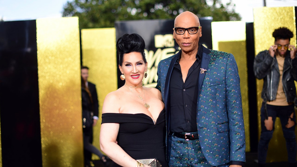 Michelle Visage and RuPaul pose on the red carpet.
