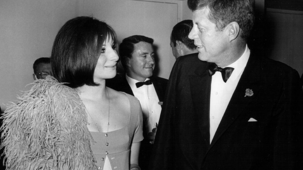 President John F. Kennedy speaks with Barbra Streisand at an event May 24, 1963