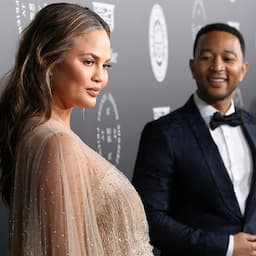 Chrissy Teigen Glows in a Stunning Silver, Feather-Covered Maternity Red Carpet Dress