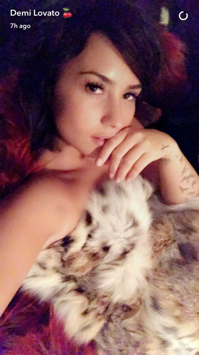 Demi Lovato Takes A Topless Nap On A Bed Of Furs During Her Wardrobe Fitting Pics