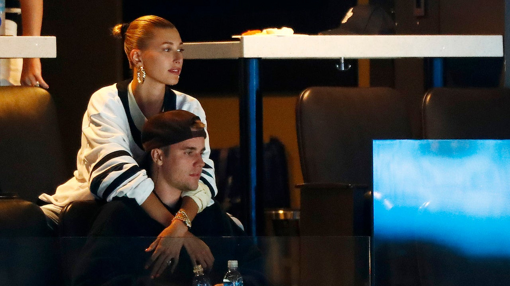 Justin Bieber and wife Hailey Rhode Bieber watch Game Seven of the Eastern Conference First Round during the 2019 NHL Stanley Cup Playoffs between the Boston Bruins and the Toronto Maple Leafs at TD Garden on April 23, 2019 in Boston, Massachusetts.
