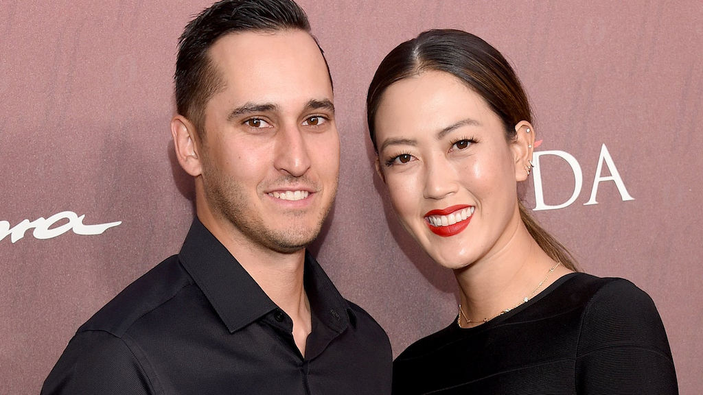 Michelle Wie and Jonnie West arrive at the Sports Illustrated Fashionable 50 at The Sunset Room on July 18, 2019 in Los Angeles, California. 