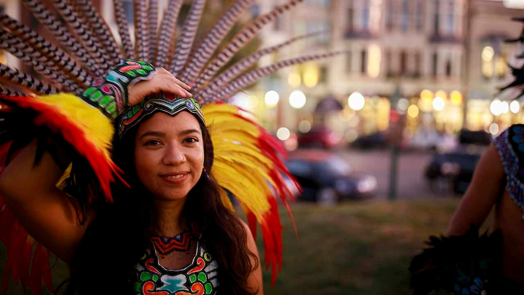 Mexica (Aztec) dancer, Miriam Cortes, of Indianapolis wears traditional costumes after performing at the Monroe County Courthouse during Indigenous Peoples Day in Bloomington. A resolution passed by the Bloomington City Council officially puts Indigenous People's Day on the calendar as a holiday every second Monday of October. 