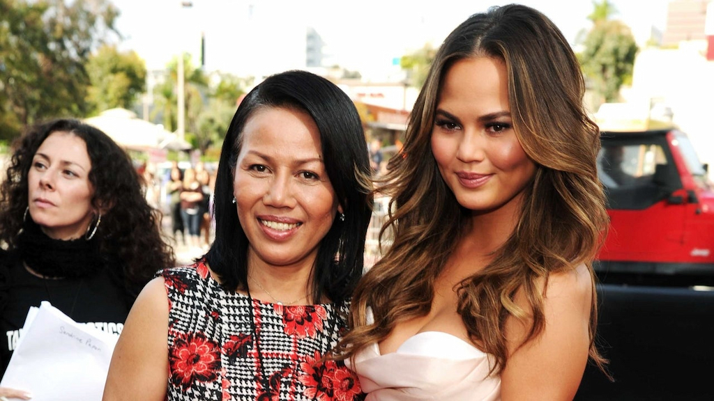 Model Chrissy Teigen (R) and Vilailuck Teigen attend the 2014 MTV Movie Awards at Nokia Theatre L.A. Live on April 13, 2014 in Los Angeles, California.