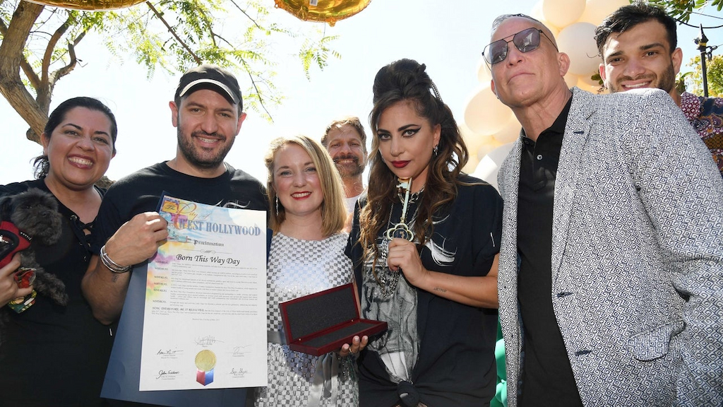 Bobby Campbell, City of West Hollywood Mayor Lindsey P. Horvath, Lady Gaga and David Cooley pose on stage as "Born This Way Day" is declared in the city of West Hollywood in celebration of the 10th anniversary of Lady Gaga's album "Born This Way" on May 23, 2021 in West Hollywood, California.