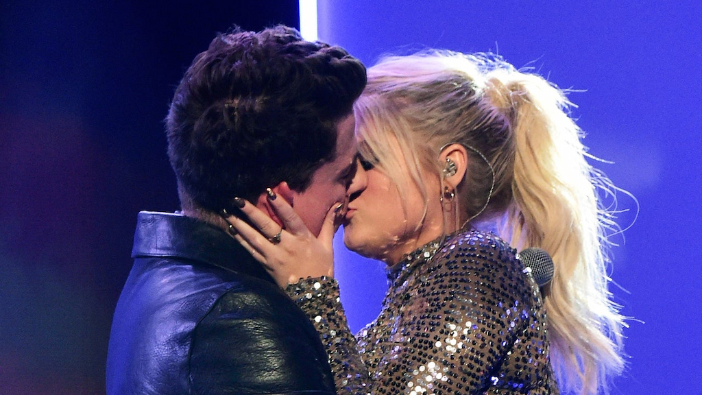 Charlie Puth (L) and Meghan Trainor kiss onstage during the 2015 American Music Awards at Microsoft Theater on November 22, 2015 in Los Angeles, California