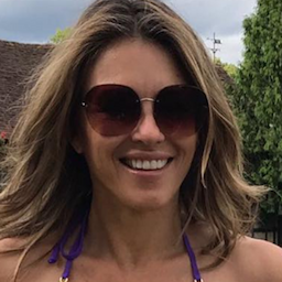 WATCH: Elizabeth Hurley Waters Her Lawn in a Stunning, Plunging Purple One Piece: 'Someone Has to Do It!'