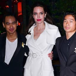 Angelina Jolie Poses With Sons Maddox and Pax at Film After Party in Trench Coat Dress: Pics