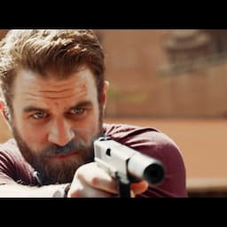 Milo Gibson Is a Mercenary on a Manhunt for a 'War Junkie' in 'All the Devil's Men' Trailer (Exclusive)