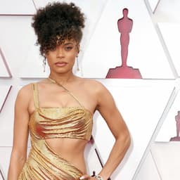 Andra Day Makes a Statement in Gold Vera Wang Gown at 2021 Oscars