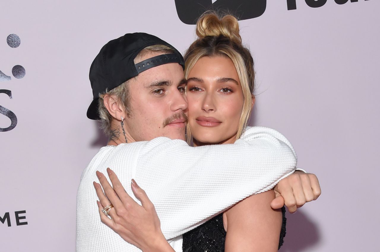 Justin Bieber shows off 'spicy' merchandise as he and wife Hailey