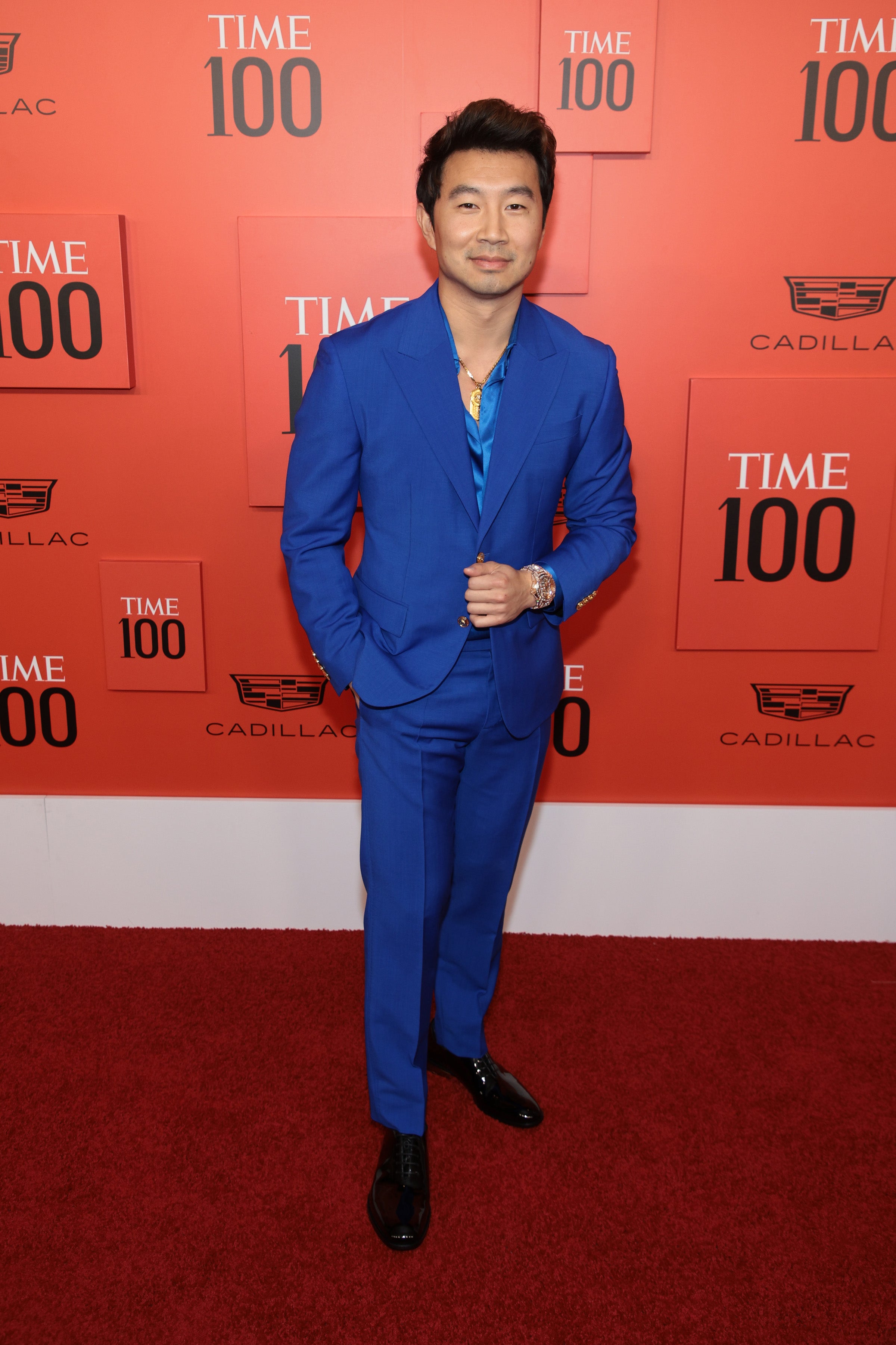 Simu Liu stands out in light blue Versace suit at 'Barbie' premiere