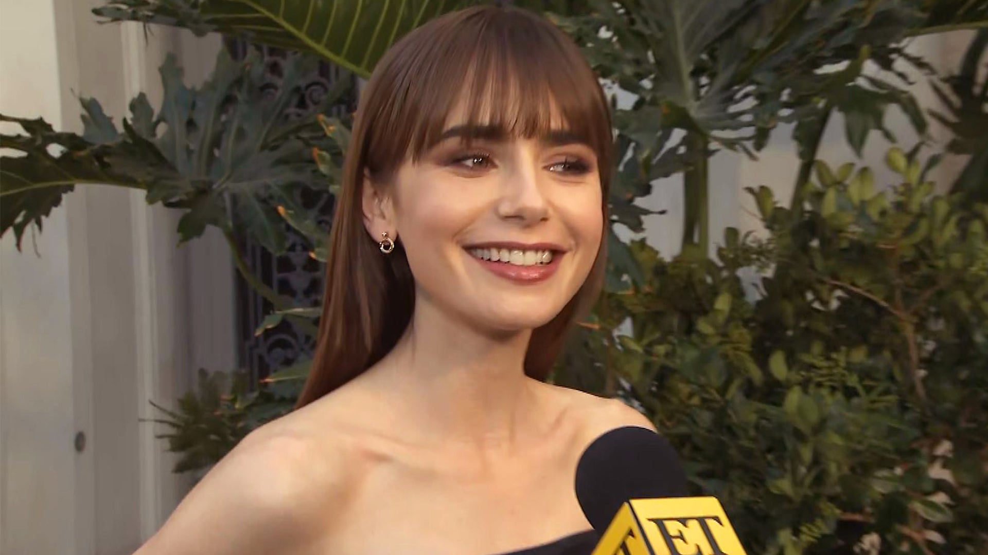Lily Collins debuts her stylish French fringe while promoting Emily In Paris  season two