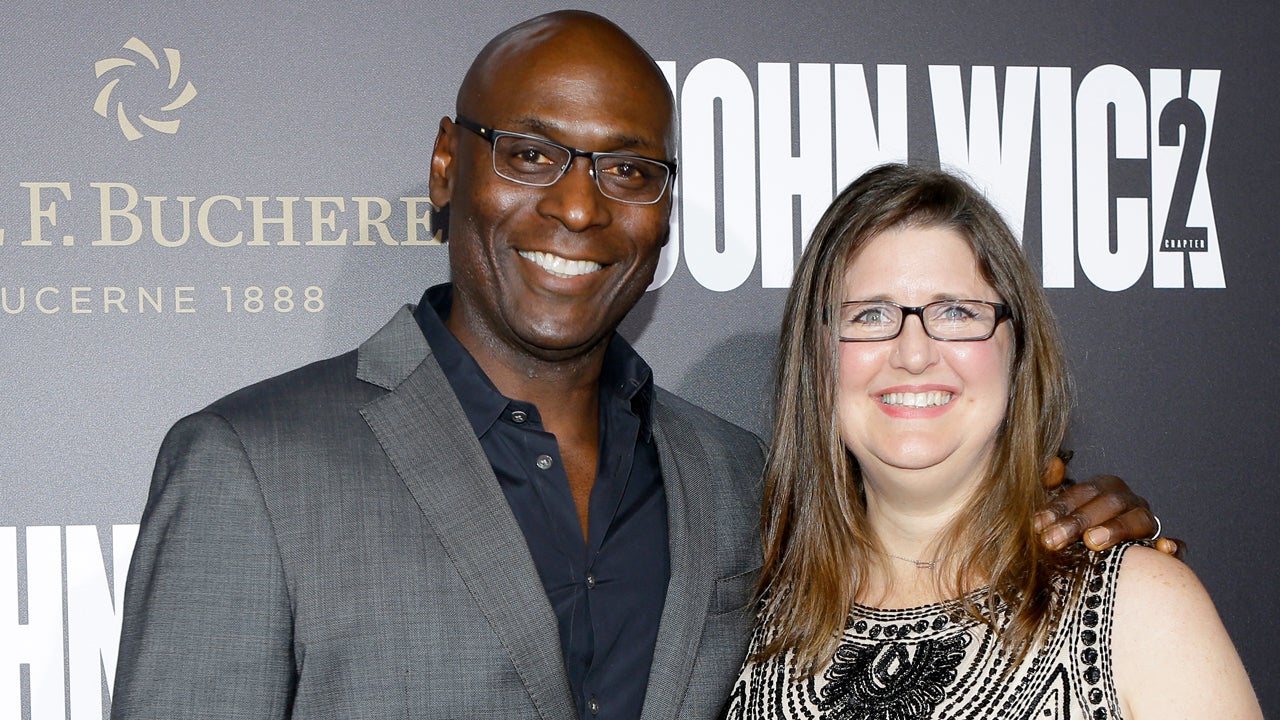 Lance Reddick and his wife