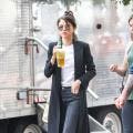 Selena Gomez Continues Chic Streak in NYC in Pinstripe Trench Coat and Flared Jeans -- See the Trendy Look!