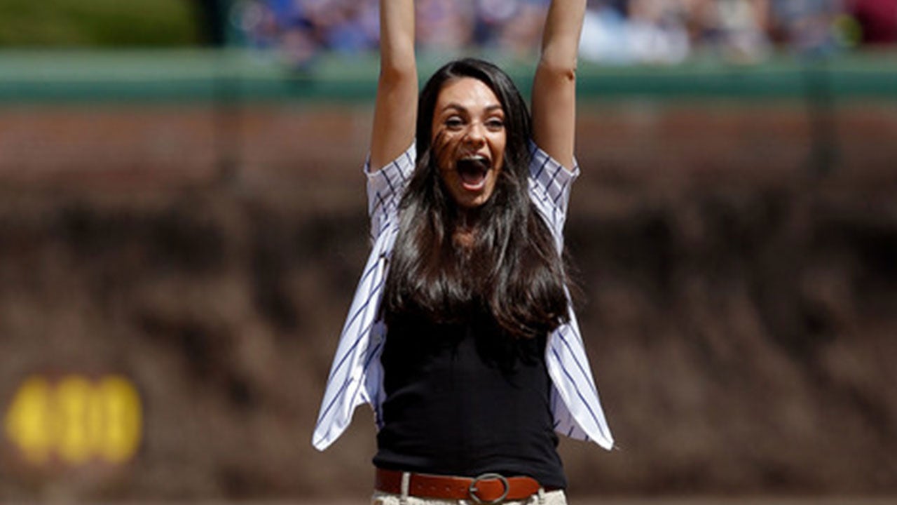 Mila Kunis throwing out the first pitch at a Chicago Cubs game.