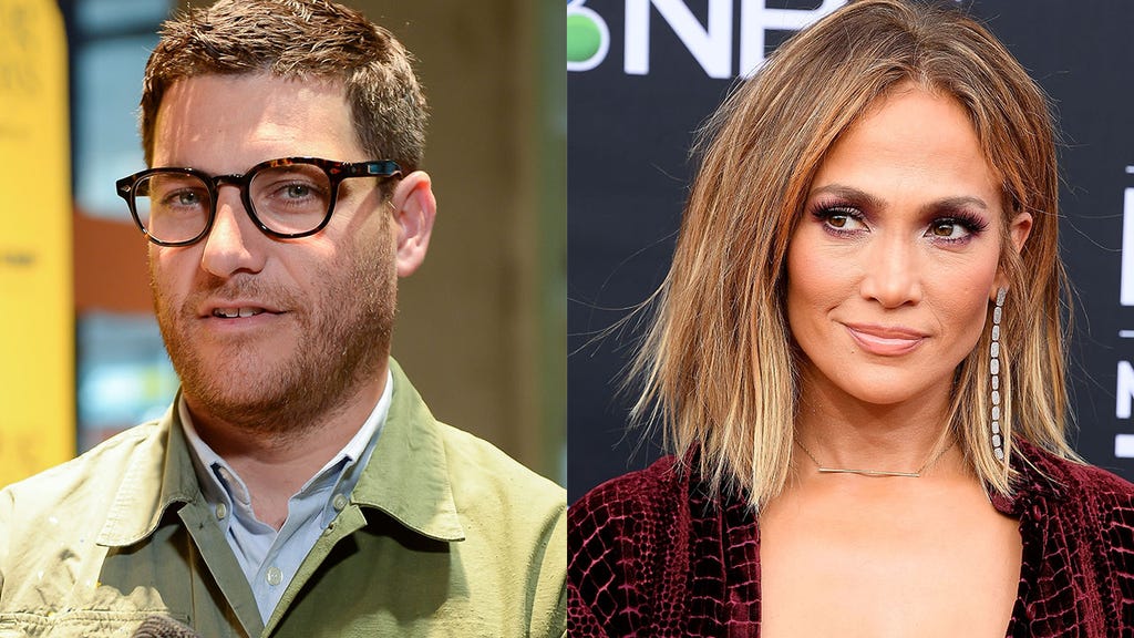 Adam Pally and Jennifer Lopez