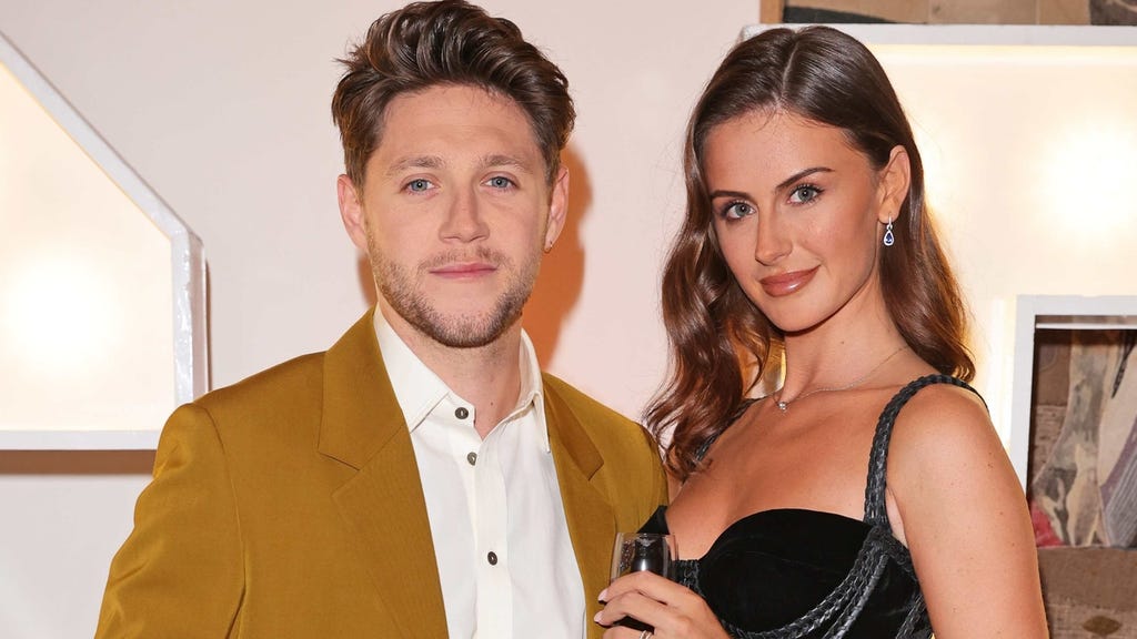 Niall Horan and Mia Woolley attend the Horan & Rose Show: Modest! Golf co-founder Niall Horan and Justin Rose brought the world of music and sport together at The Grove, presenting an evening of entertainment to raise money for The Black Heart Foundation on September 03, 2021 in Watford, England