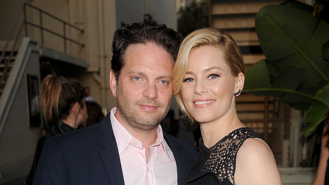 Elizabeth Banks and husband Max Handelman arrive at the Los Angeles premiere of Hulu's "Resident Advisors" at Sherry Lansing Theatre at Paramount Studios on March 31, 2015 in Los Angeles, California. 