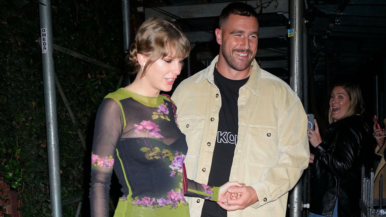Taylor Swift kisses Travis Kelce on the cheek in a rare PDA photo