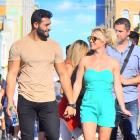 Britney Spears and her boyfriend Sam Asghari hold hands while out celebrating her sons' birthdays at Disneyland