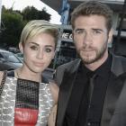 Miley Cyrus and Liam Hemsworth pack on PDA
