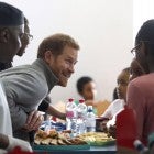 Prince Harry serves food to children as part of the Fit and Fed initiative in London