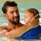 Michael Phelps swims in a pool with son Boomer.