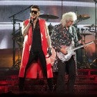 Adam Lambert and Brian May perform on stage at the O2 Arena in London, England, on July 1.