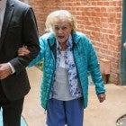 A beaming Betty White looks happy and healthy as she runs errands the day before her 97th birthday. 