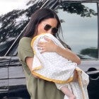 Watch Meghan Markle Cradle Archie During Surprise Appearance at a Charity Polo Match 