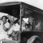 Rear View of Truck carrying African Americans during Riot, Tulsa, Oklahoma, USA, Alvin C. Krupnick Co., 1921.
