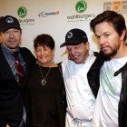 Donnie Wahlberg, their mother Alma Elaine Wahlberg, chef Paul Wahlberg and Mark Wahlberg attend the grand opening of Wahlburgers on October 24, 2011 at the Hingham Shipyard in Boston, Massachusetts.