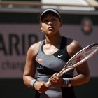 Naomi Osaka of Japan looks frustrated during her match against Patricia Maria Țig of Romania in the first round of the women’s singles at Roland Garros on May 30, 2021 in Paris, France.