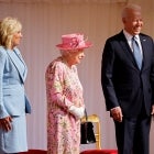 US President Joe Biden (R) and US First Lady Jill Biden (L) share a joke with with Britain's Queen Elizabeth II (C) before watching the military march past at Windsor Castle in Windsor, west of London, on June 13, 2021. - US president Biden will visit Windsor Castle late Sunday, where he and First Lady Jill Biden will take tea with the queen. 