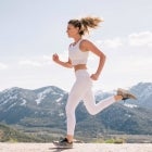 Woman Running on Mountain