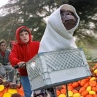 Elliott and E.T. prepare to escape law enforcement with an aerial flight in the movie's climatic moments.
