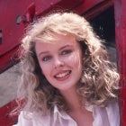 Kylie Minogue poses with a train to promote 'The Loco-Motion' in 1988. 