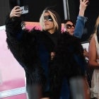 Kourtney Kardashian stands on the side of the stage as her husband Travis Barker performs with his band Blink-182 during the first week-end of Coachella Valley Music and Arts Festival in Indio, California, on April 14, 2023.