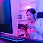 Woman wearing headset and playing game