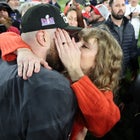 Taylor Swift and Travis Kelce kiss