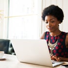 Woman using laptop at home