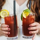 woman holding iced tea