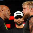 Mike Tyson, Nakisa Bidarian and Jake Paul pose onstage during Arlington press conference