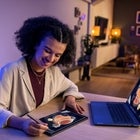 Woman using Lenovo laptop