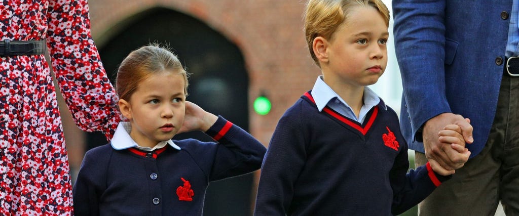 Princess Charlotte of Cambridge, with her brother, Britain's Prince George of Cambridge, arrives for her first day of school at Thomas's Battersea in London