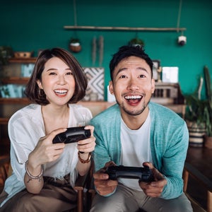 Couple playing video games together