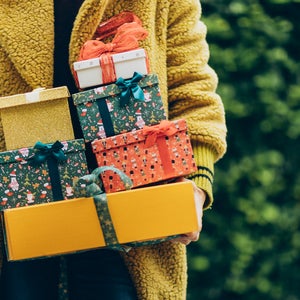 woman holding Christmas gifts