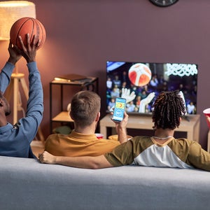 People watching basketball on TV