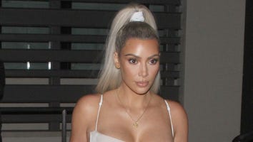 Kim Kardashian Steps Out for Dinner With Friends in Sexy White Number